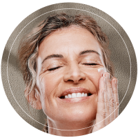 Elderly Woman Applying Moisturizer