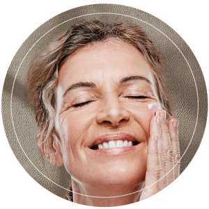 Elderly Woman Applying Moisturizer