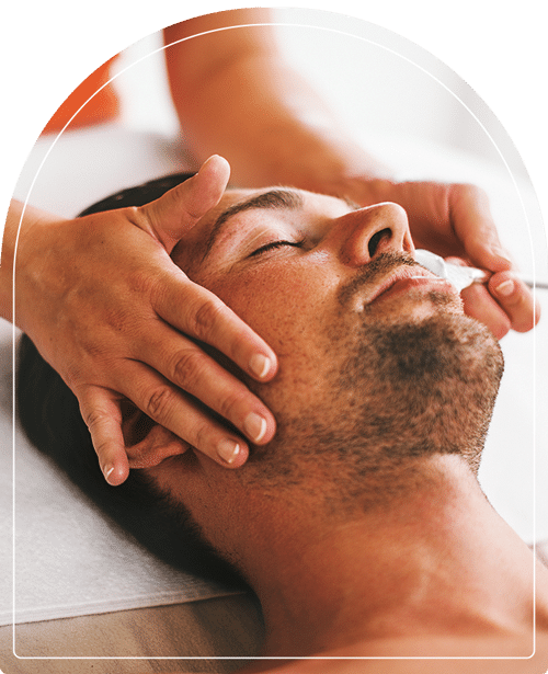 Clinician treating a man to a facial