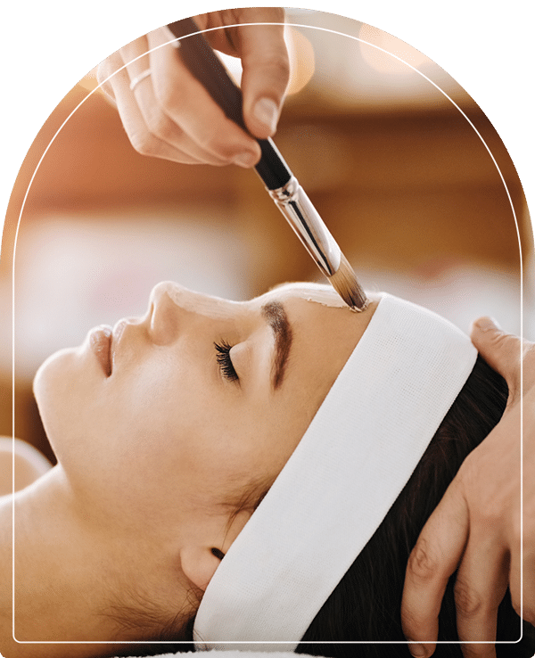 Applying a chemical peel to a woman's face