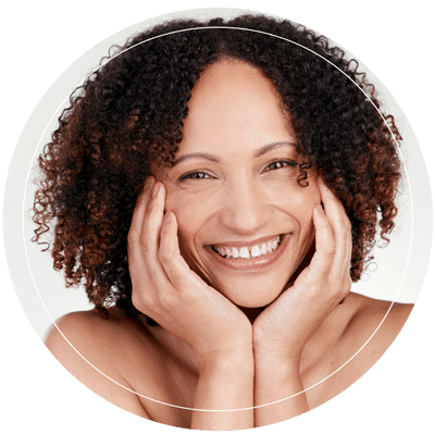 A happy woman showing her healthy, smooth skin