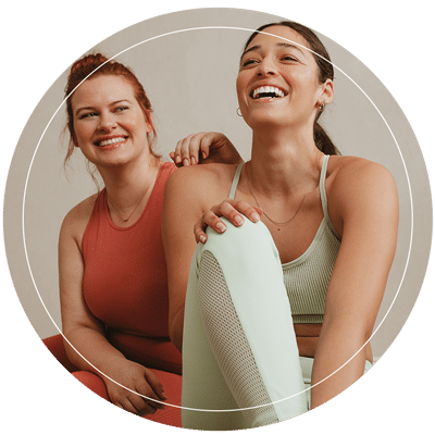 Two friends practicing yoga together